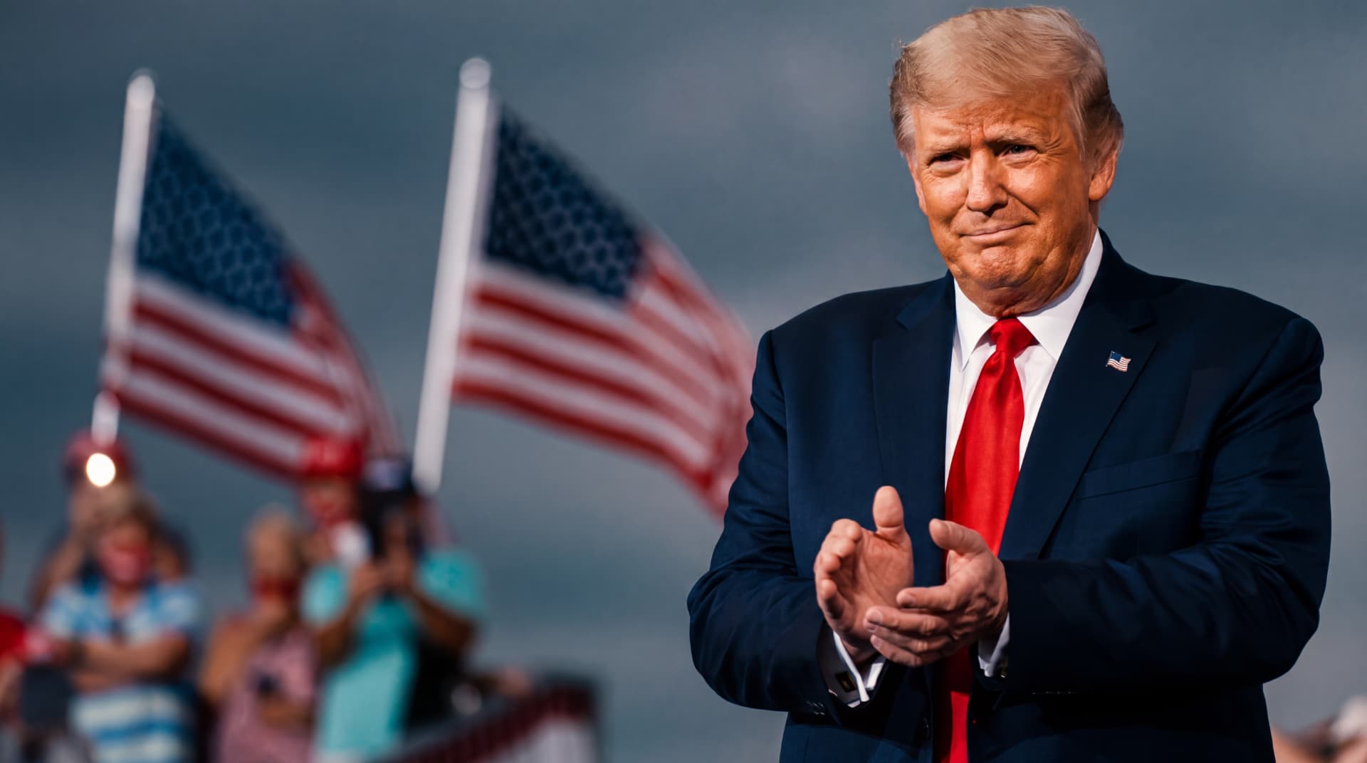 President Donald Trump with American flags at a rally